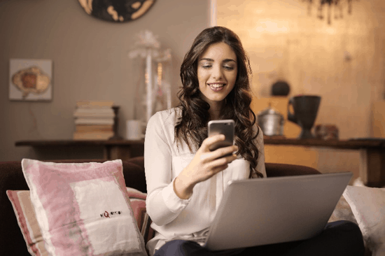 woman reading on mobile phone