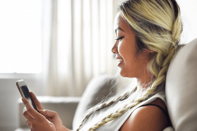 Woman reading on mobile phone