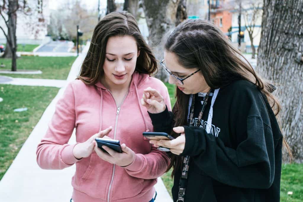 Girls checking phones