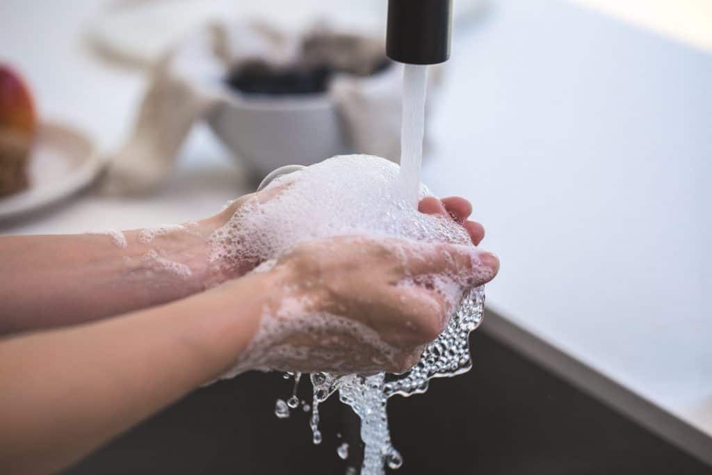 A person washing their hands