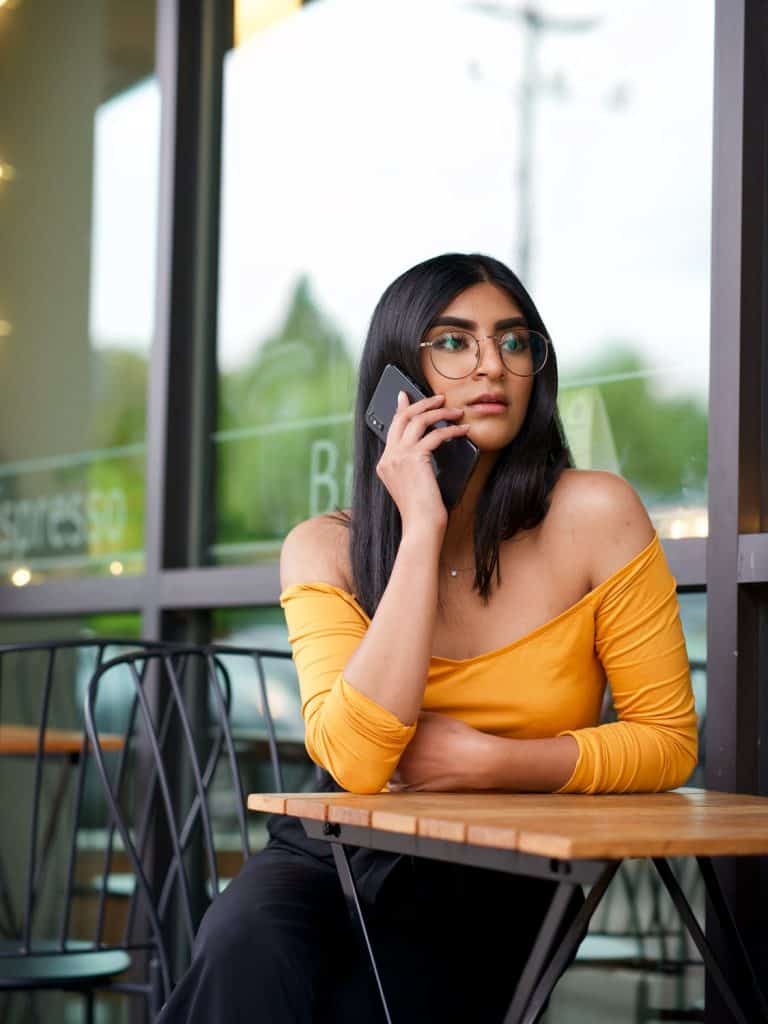 A girl on the phone looking concerned