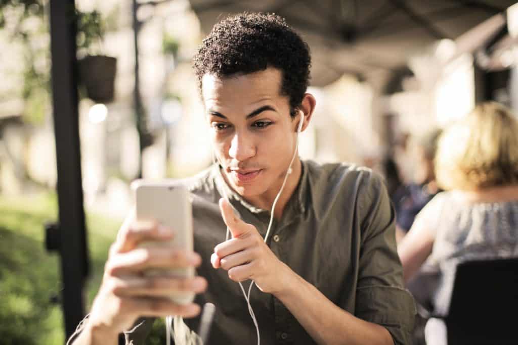 A young man on a video call with headphones. 