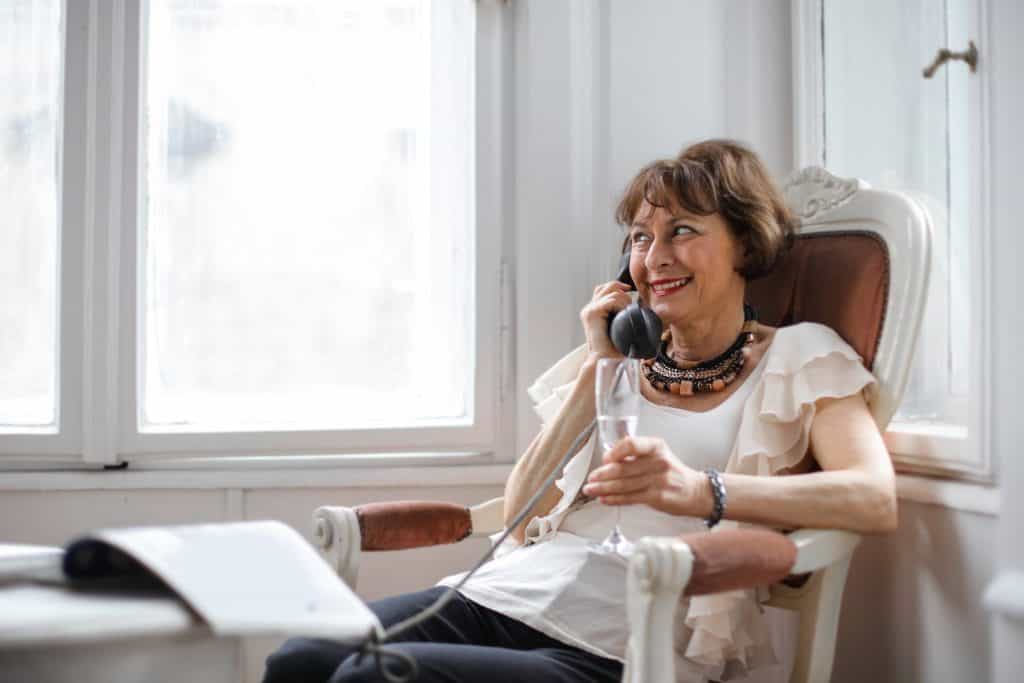 An elderly woman on the phone