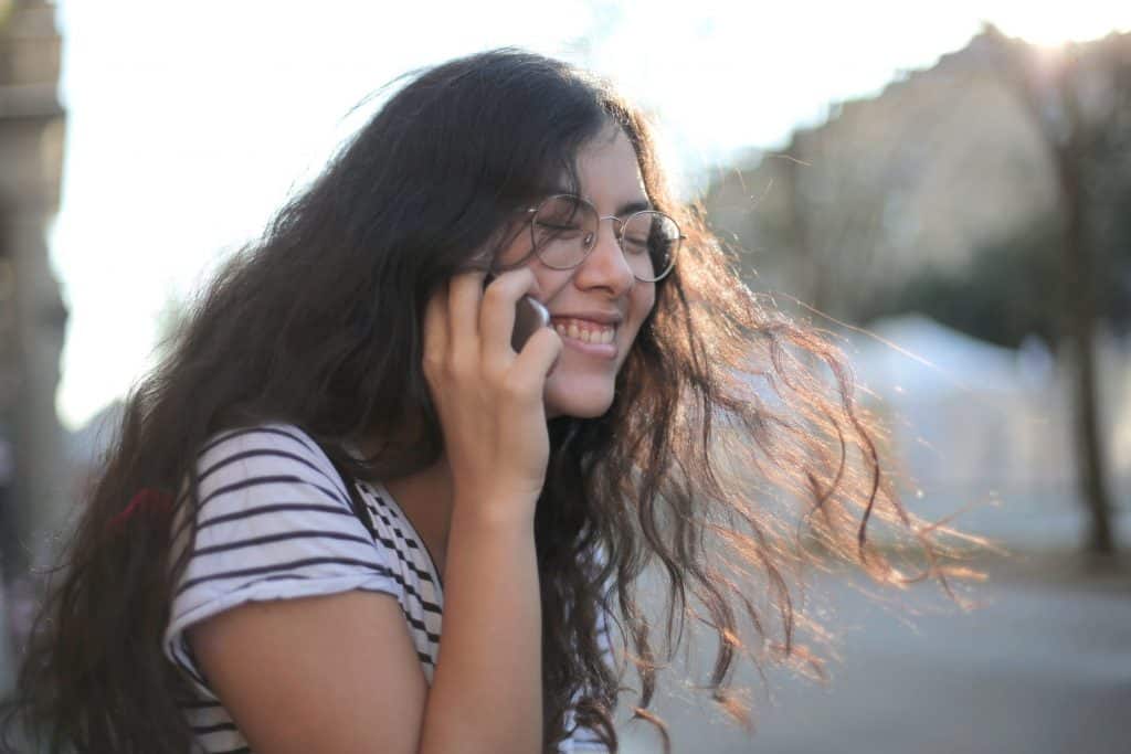 A girl laughing on the phone