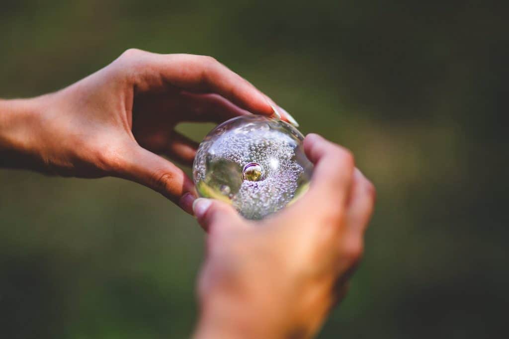 A woman holding a crystal ball