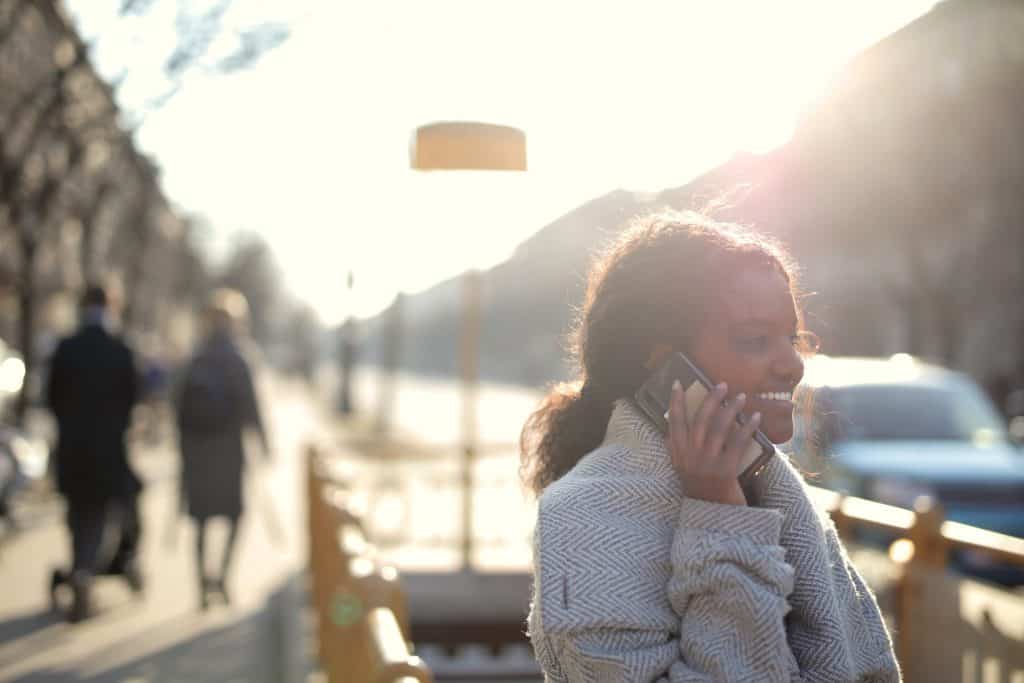 A woman wearing a white knit sweater