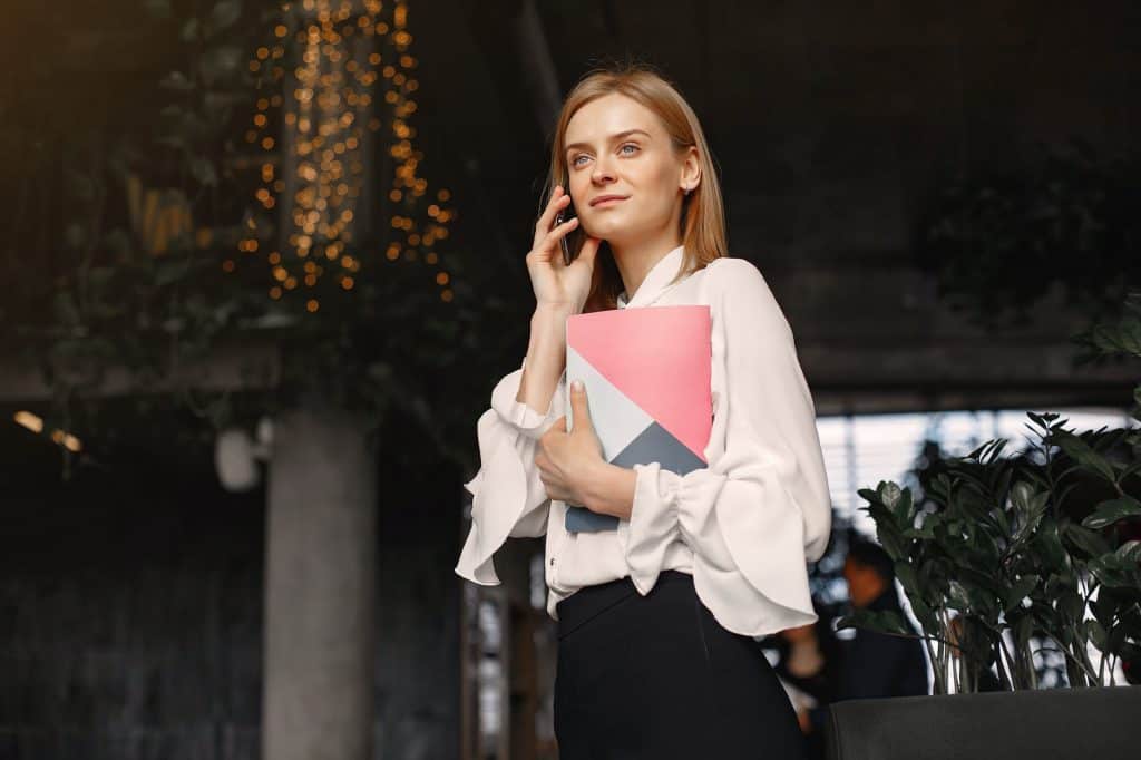 A professional woman speaking on the phone