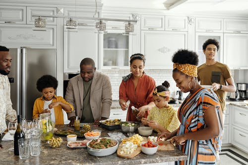 A family preparing dinner together in the kitchen