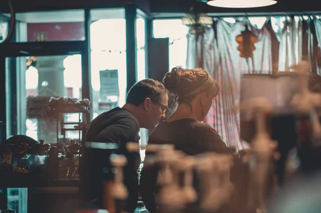 A man and a woman inside a shop 