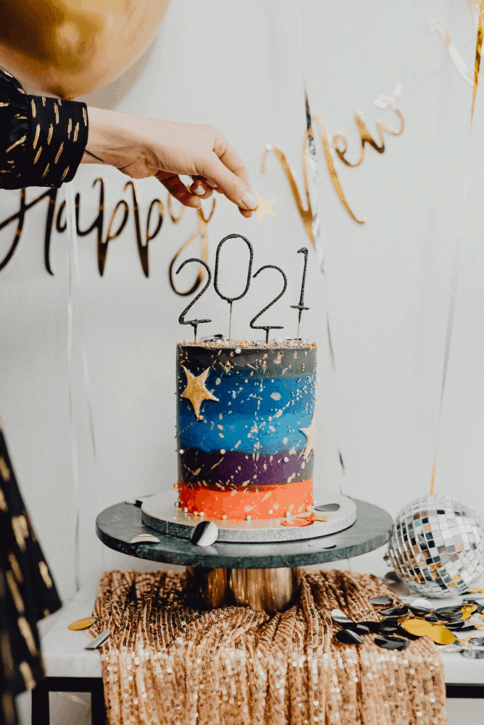 A 2021 New Years cake being lit
