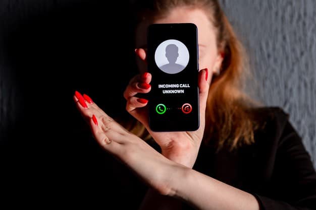 A woman holding a phone with no Caller ID